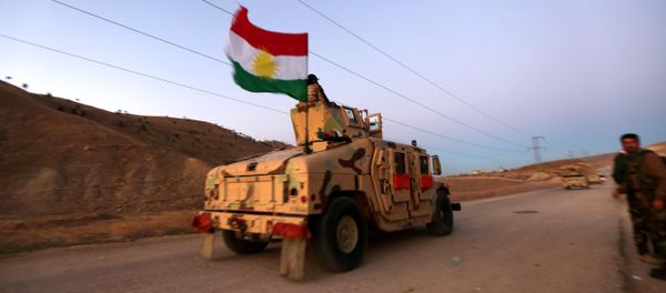 Iraqi Kurdish forces take part in an operation backed by US-led strikes on the outskirts of northern Iraqi town of Sinjar on November 12, 2015, to retake the town from the Islamic State group and cut a key supply line to Syria Iraqi Kurdish forces take part in an operation backed by US-led strikes on the outskirts of northern Iraqi town of Sinjar on November 12, 2015, to retake the town from the Islamic State group and cut a key supply line to Syria - Sputnik International