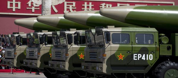 Military vehicles carrying DF-26 ballistic missiles drive past Tiananmen Gate during a military parade at Tiananmen Square in Beijing on September 3, 2015, to mark the 70th anniversary of victory over Japan and the end of World War II - Sputnik International