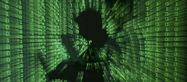 An illustration picture shows a projection of binary code on a man holding a laptop computer. - Sputnik International
