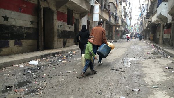 Residents of Nubel, in the north of Aleppo Province in Syria, after the removal of a long-term siege - Sputnik International