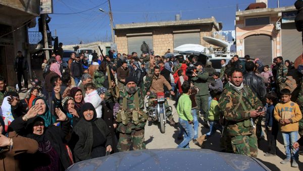 Residents of Nubul and al-Zahraa, along with forces loyal to Syria's President Bashar al-Assad, celebrate after the siege of their towns was broken, northern Aleppo countryside, Syria, in this handout picture provided by SANA on February 4, 2016 Residents of Nubul and al-Zahraa, along with forces loyal to Syria's President Bashar al-Assad, celebrate after the siege of their towns was broken, northern Aleppo countryside, Syria, in this handout picture provided by SANA on February 4, 2016 - Sputnik International