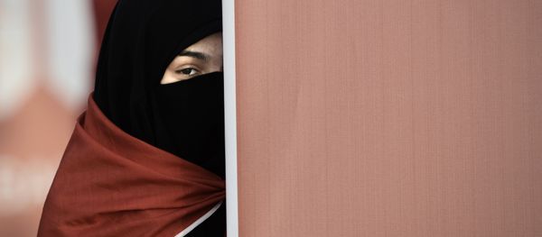 A Bahraini woman takes part in an anti-government protest that marks a 1000 days since the Shiite-led uprising demanding democratic reforms in Sunni-ruled but Shiite-majority Bahrain, in the village of al-Shakhurah, west of Manama, on December 13, 2013. A Bahraini woman takes part in an anti-government protest that marks a 1000 days since the Shiite-led uprising demanding democratic reforms in Sunni-ruled but Shiite-majority Bahrain, in the village of al-Shakhurah, west of Manama, on December 13, 2013. - Sputnik International