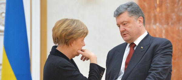 German Chancellor Angela Merkel and Ukrainian President Petro Poroshenko before an expanded meeting to discuss a peace plan for Ukraine, held by the Russian, German, French and Ukrainian leaders German Chancellor Angela Merkel and Ukrainian President Petro Poroshenko before an expanded meeting to discuss a peace plan for Ukraine, held by the Russian, German, French and Ukrainian leaders - Sputnik International