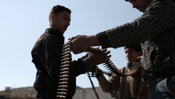 Opposition fighters belonging to Jaish al-Islam (Islam Army), the foremost rebel group in Damascus province who fiercely oppose to both the regime and the Islamic State group, check their ammunition belts in Tal al-Aswan in the area of the eastern Ghouta rebel bastion east of the Syrian capital, Damascus, during clashes with government forces on February 9, 2016. Opposition fighters belonging to Jaish al-Islam (Islam Army), the foremost rebel group in Damascus province who fiercely oppose to both the regime and the Islamic State group, check their ammunition belts in Tal al-Aswan in the area of the eastern Ghouta rebel bastion east of the Syrian capital, Damascus, during clashes with government forces on February 9, 2016. - Sputnik International