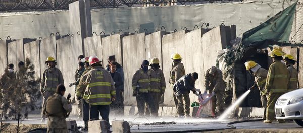 Afghan fire-fighters and members of security forces clean the site of a suicide attack in Kabul, Afghanistan. Afghan fire-fighters and members of security forces clean the site of a suicide attack in Kabul, Afghanistan. - Sputnik International