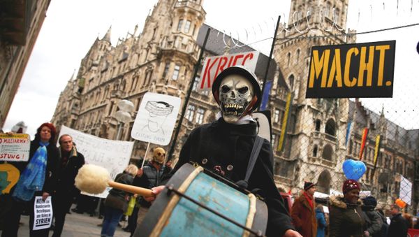 A protester takes part in a demonstration against the Munich Security Conference in downtown Munich, Germany, February 13, 2016. A protester takes part in a demonstration against the Munich Security Conference in downtown Munich, Germany, February 13, 2016. - Sputnik International