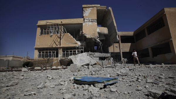 A book is left on the ground at the yard of a school in Tel Rifaat, on the outskirts of Aleppo, Syria (file photo) - Sputnik International