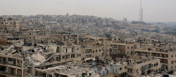 A picture taken on November 24, 2014, shows damaged buildings in the rebel-held Ansari disctrict of the northern Syrian city of Aleppo. - Sputnik International