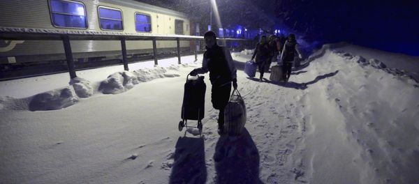 Refugees disembark and make their way to a camp at a hotel touted as the world's most northerly ski resort in Riksgransen, Sweden, in this December 15, 2015 file photo. Refugees disembark and make their way to a camp at a hotel touted as the world's most northerly ski resort in Riksgransen, Sweden, in this December 15, 2015 file photo. - Sputnik International