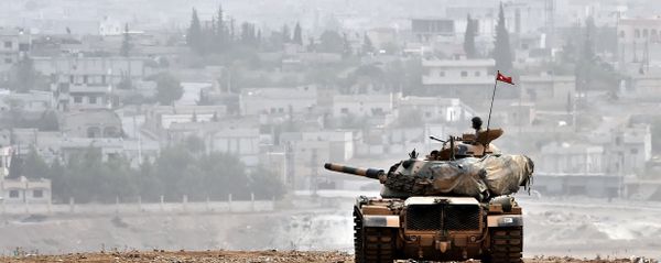 Turkish soldiers on a tank sit opposite the Syrian town of Ain al-Arab, known as Kobane by the Kurds, at the Turkish-Syrian border in the southeastern Turkish village of Mursitpinar, Sanliurfa province (File) Turkish soldiers on a tank sit opposite the Syrian town of Ain al-Arab, known as Kobane by the Kurds, at the Turkish-Syrian border in the southeastern Turkish village of Mursitpinar, Sanliurfa province (File) - Sputnik International