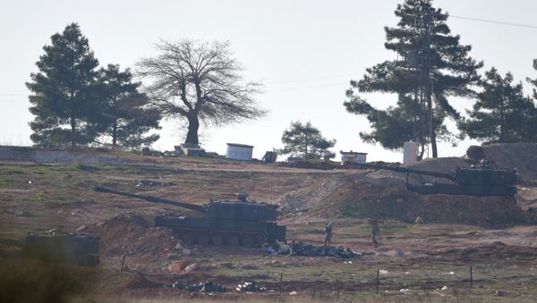 Soldiers carry ammunition as Turkish artillery fire from the border near Kilis toward northern Syria, in Kilis, Turkey, Monday, Feb. 15, 2016 - Sputnik International