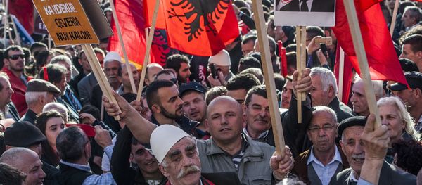 Kosovo Albanians, some holding Alkbania's flag, gather in Pristina on February 17,2016 for a major anti-government rally to mark their eighth anniversary of independence from Serbia. Kosovo Albanians, some holding Alkbania's flag, gather in Pristina on February 17,2016 for a major anti-government rally to mark their eighth anniversary of independence from Serbia. - Sputnik International