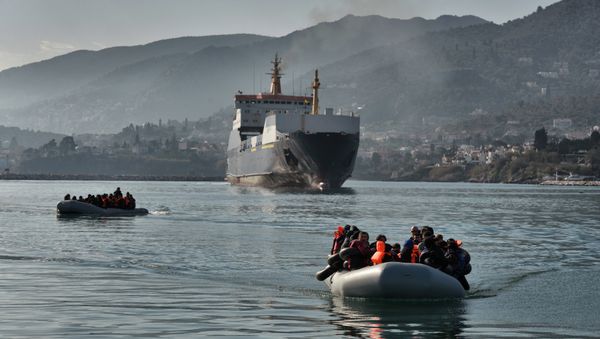 Refugees and migrants arrive on a dinghy at the port of Mytilene, on the Greek island of Lesbos, after crossing the Aegean sea from Turkey, on February 18, 2016 Refugees and migrants arrive on a dinghy at the port of Mytilene, on the Greek island of Lesbos, after crossing the Aegean sea from Turkey, on February 18, 2016 - Sputnik International