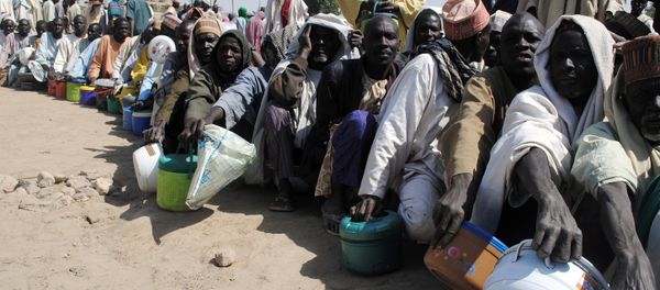 Internally Displaced Persons (IDP) mostly men sit in line waiting to be served with food at Dikwa Camp, in Borno State in north-eastern Nigeria, on February 2, 2016 Internally Displaced Persons (IDP) mostly men sit in line waiting to be served with food at Dikwa Camp, in Borno State in north-eastern Nigeria, on February 2, 2016 - Sputnik International