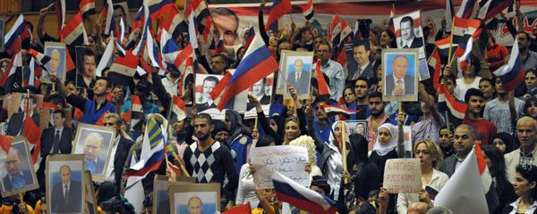 Residents of Latakia, Syria hold a rally to mark the Russian holiday of National Unity Day and to express gratitude to Russia for its combat operation in their country Residents of Latakia, Syria hold a rally to mark the Russian holiday of National Unity Day and to express gratitude to Russia for its combat operation in their country - Sputnik International