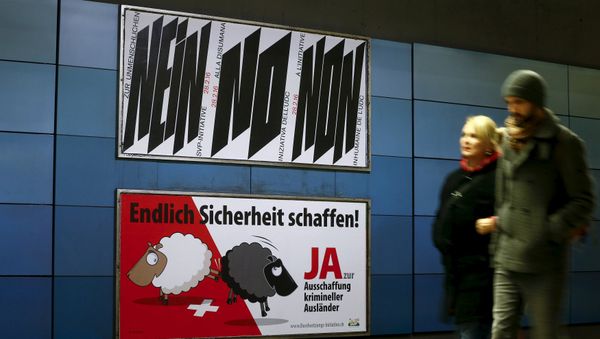 A poster of Swiss People's Party (SVP), demanding to vote for an initiative to deport criminal foreigners, is placed underneath another one against it at the central railway station in Zurich, Switzerland February 12, 2016 - Sputnik International