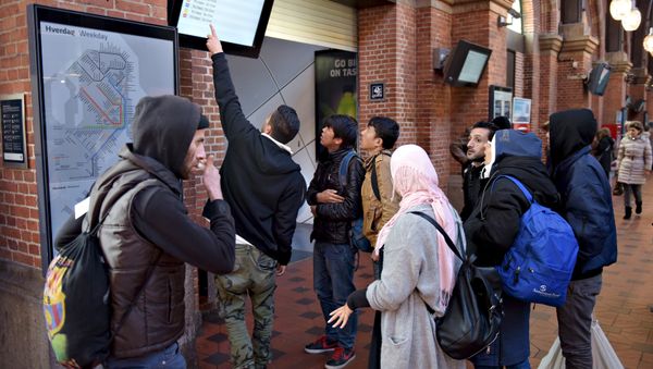 A group of migrants check a departure board at Copenhagen Central Station, Denmark, November 12, 2015 (photo used for illustration purpose) A group of migrants check a departure board at Copenhagen Central Station, Denmark, November 12, 2015 (photo used for illustration purpose) - Sputnik International