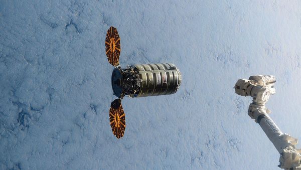 This image made available by NASA via Twitter shows the Cygnus spacecraft approaching the International Space Station on Wednesday, Dec. 9, 2015 - Sputnik International