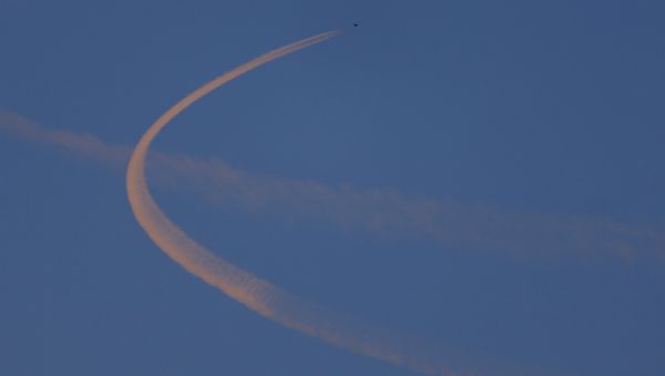 A fighter jet flies close to the border in Syrian air space as seen from Turkey's Oncupinar border crossing on the Turkish-Syrian border in Kilis, Turkey, February 9, 2016 - Sputnik International