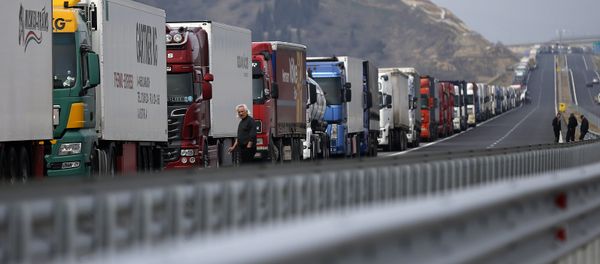 Trucks are seen on a highway near the Kulata border crossing between Bulgaria and Greece, Bulgaria February 17, 2016 - Sputnik International