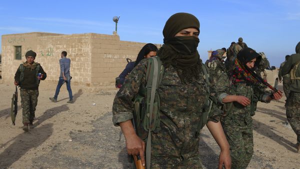 Fighters from the Democratic Forces of Syria carry their weapons in Ghazila village after taking control of the town from Islamic State forces in the southern countryside of Hasaka, Syria February 17, 2016 - Sputnik International