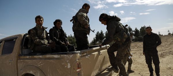 Fighters from the Syrian Democratic Forces (SDF) are transported to the front line of the town of Chaddade in the northeastern Syrian province of Hasaka, on February 19, 2016 Fighters from the Syrian Democratic Forces (SDF) are transported to the front line of the town of Chaddade in the northeastern Syrian province of Hasaka, on February 19, 2016 - Sputnik International