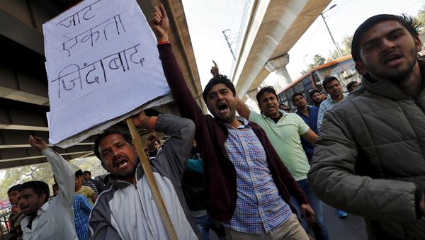 Demonstrators from the Jat community shout slogans during a protest in New Delhi, India, February 21, 2016 Demonstrators from the Jat community shout slogans during a protest in New Delhi, India, February 21, 2016 - Sputnik International