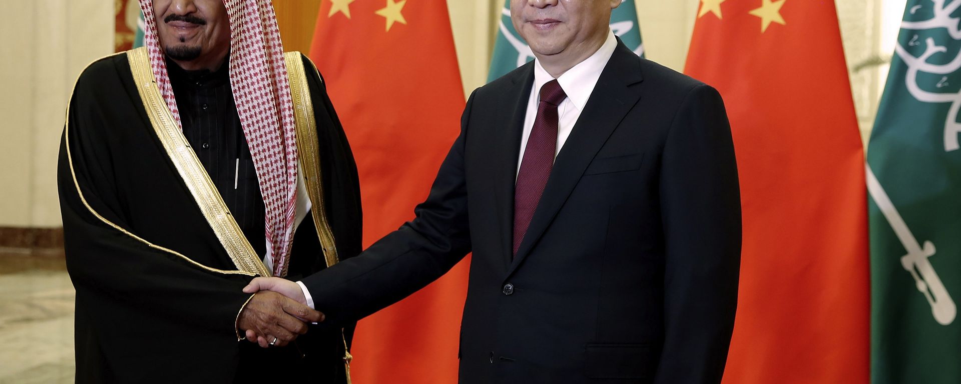 Chinese President Xi Jinping, right, shakes hands with Saudi Prince Salman bin Abdul-Aziz as they pose for photos at the Great Hall of the People in Beijing, China, Thursday, March 13, 2014 Chinese President Xi Jinping, right, shakes hands with Saudi Prince Salman bin Abdul-Aziz as they pose for photos at the Great Hall of the People in Beijing, China, Thursday, March 13, 2014 - Sputnik International, 1920, 07.11.2022