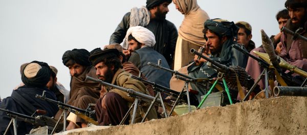 In this photograph taken on November 3, 2015, Afghan Taliban fighters listen to Mullah Mohammad Rasool Akhund (unseen), the newly appointed leader of a breakaway faction of the Taliban, at Bakwah in the western province of Farah In this photograph taken on November 3, 2015, Afghan Taliban fighters listen to Mullah Mohammad Rasool Akhund (unseen), the newly appointed leader of a breakaway faction of the Taliban, at Bakwah in the western province of Farah - Sputnik International