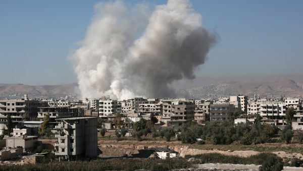 Smoke billows from buildings following a reported air strike in Damascus' rebel-held suburb of Zamalka on December 6, 2015 Smoke billows from buildings following a reported air strike in Damascus' rebel-held suburb of Zamalka on December 6, 2015 - Sputnik International