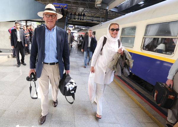 Tourists walk on a platform at a station in Tehran after arriving in the Iranian capital on a luxury train from Budapest - Sputnik International
