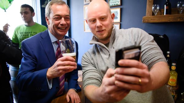 UK Independence Party (UKIP) leader Nigel Farage (L) poses for a selfie with Martin Clarke, owner of The Little Ale House, in Wellingborough, UK. UK Independence Party (UKIP) leader Nigel Farage (L) poses for a selfie with Martin Clarke, owner of The Little Ale House, in Wellingborough, UK. - Sputnik International