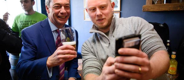 UK Independence Party (UKIP) leader Nigel Farage (L) poses for a selfie with Martin Clarke, owner of The Little Ale House, in Wellingborough, UK. UK Independence Party (UKIP) leader Nigel Farage (L) poses for a selfie with Martin Clarke, owner of The Little Ale House, in Wellingborough, UK. - Sputnik International