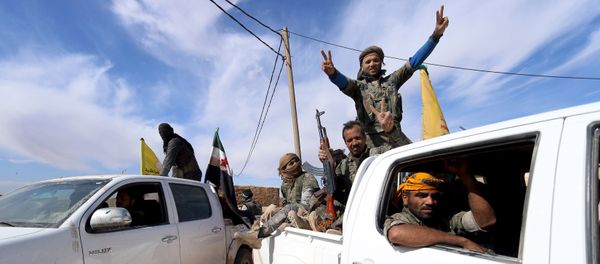 Syria Democratic Forces and Free Syrian Army fighters gesture on the back of pick-up trucks in a village on the outskirts of al-Shadadi town, Hasaka countryside, Syria Syria Democratic Forces and Free Syrian Army fighters gesture on the back of pick-up trucks in a village on the outskirts of al-Shadadi town, Hasaka countryside, Syria - Sputnik International