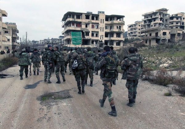 In this photo released on Tuesday, Jan 12, 2016, by the Syrian official news agency SANA, shows Syrian government troops and allied militiamen walk inside the key town of Salma in Latakia province, Syria In this photo released on Tuesday, Jan 12, 2016, by the Syrian official news agency SANA, shows Syrian government troops and allied militiamen walk inside the key town of Salma in Latakia province, Syria - Sputnik International