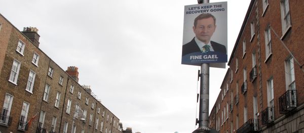This photo taken Friday, Feb. 5, 2016, shows an election poster picturing Prime Minister Enda Kenny adorning a lamp post outside the headquarters of his Fine Gael party in Dublin, Ireland - Sputnik International