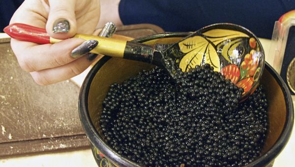 Wooden bowl with sturgeon caviar on display at the third international exhibition Fish-2003. File photo. - Sputnik International