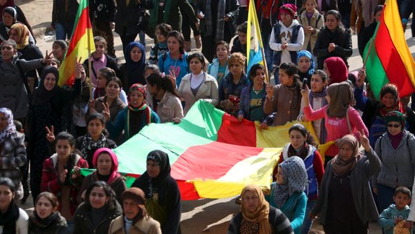 Kurdish people carry flags as they march during a protest in the city of al-Derbasiyah, on the Syrian-Turkish border, against what the protesters said were the operations launched in Turkey by government security forces against the Kurds, February 9, 2016 Kurdish people carry flags as they march during a protest in the city of al-Derbasiyah, on the Syrian-Turkish border, against what the protesters said were the operations launched in Turkey by government security forces against the Kurds, February 9, 2016 - Sputnik International