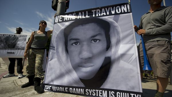 Americans angry at the acquittal of George Zimmerman in the death of black teen Trayvon Martin protest in Los Angeles, California July 14, 2013 - Sputnik International