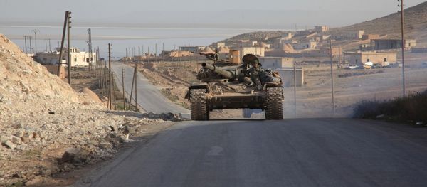 Syrian government forces drive a tank on a road during a military operation against Daesh in the villages of Zarour and Khanaser, in the Aleppo province, on February 26, 2016 Syrian government forces drive a tank on a road during a military operation against Daesh in the villages of Zarour and Khanaser, in the Aleppo province, on February 26, 2016 - Sputnik International