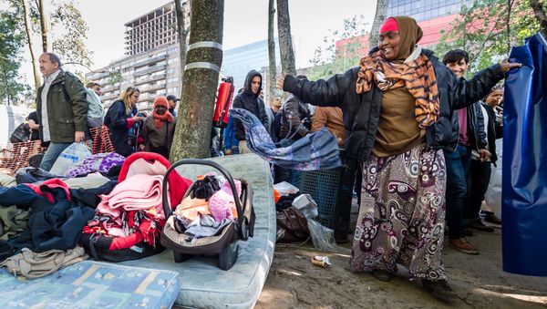 Refugees leave a tent camp for refugees in Brussels on Thursday, Oct. 1, 2015 Refugees leave a tent camp for refugees in Brussels on Thursday, Oct. 1, 2015 - Sputnik International