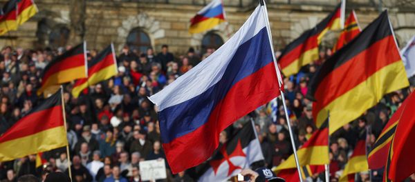 Supporters of the anti-Islam movement Patriotic Europeans Against the Islamisation of the West (PEGIDA) carry German and Russian flags during a demonstration in Dresden, Germany, February 6, 2016 Supporters of the anti-Islam movement Patriotic Europeans Against the Islamisation of the West (PEGIDA) carry German and Russian flags during a demonstration in Dresden, Germany, February 6, 2016 - Sputnik International