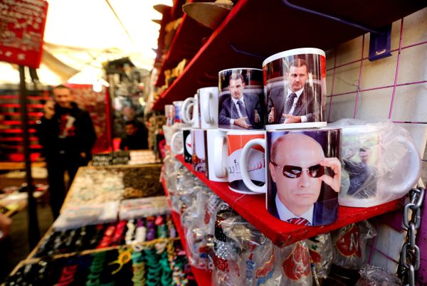 A Syrian vendor sells mugs bearing portraits of Russian President Vladimir Putin (bottom) and Syrian President Bashar Assad (top) in the popular Hamidiyeh market in the old part of the capital Damascus on November 26, 2015 A Syrian vendor sells mugs bearing portraits of Russian President Vladimir Putin (bottom) and Syrian President Bashar Assad (top) in the popular Hamidiyeh market in the old part of the capital Damascus on November 26, 2015 - Sputnik International