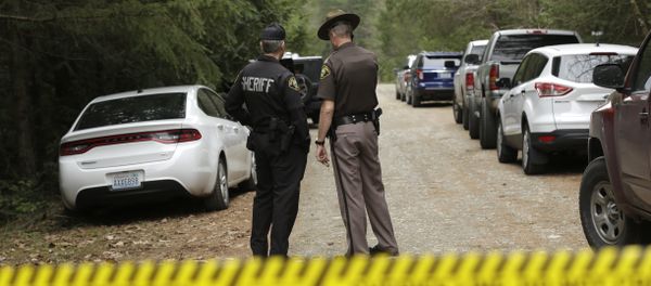 Mason County Sheriff's Chief Criminal Deputies Russ Osterhout, left, and Ryan Spurling, right, stand on a road near the scene of a fatal shooting Friday, Feb. 26, 2016, near Belfair, Wash. - Sputnik International
