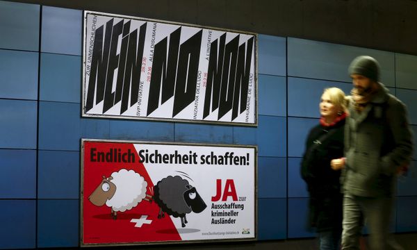 A poster of Swiss People's Party (SVP), demanding to vote for an initiative to deport criminal foreigners, is placed underneath another one against it at the central railway station in Zurich, Switzerland in this February 12, 2016 file photo A poster of Swiss People's Party (SVP), demanding to vote for an initiative to deport criminal foreigners, is placed underneath another one against it at the central railway station in Zurich, Switzerland in this February 12, 2016 file photo - Sputnik International