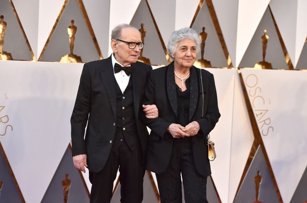 Ennio Morricone, left, and Maria Travia arrive at the Oscars on Sunday, Feb. 28, 2016, at the Dolby Theatre in Los Angeles.  - Sputnik International