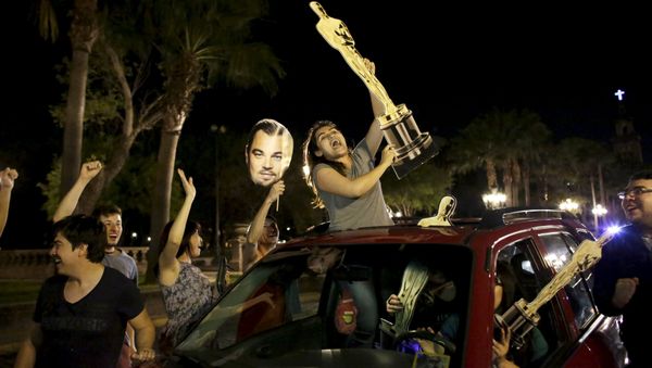 Fans celebrate the win by Alejandro Inarritu for Best Director and Leonardo DiCaprio for Best Actor in his leading role for the movie The Revenant at the 88th Academy Awards in Hollywood, in Monterrey, February 29, 2016 - Sputnik International