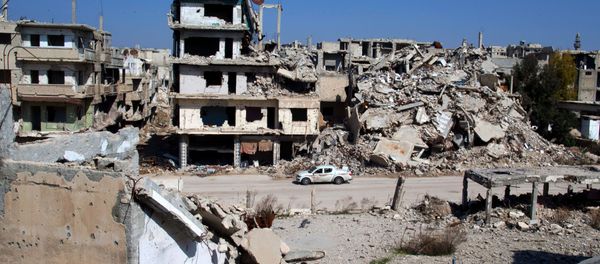 In this picture taken Friday, Feb. 26, 2016, a car drives through a devastated part of the old city of Homs, Syria In this picture taken Friday, Feb. 26, 2016, a car drives through a devastated part of the old city of Homs, Syria - Sputnik International
