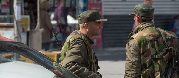 Syrian soldier on a street of Damascus on the first day of truce Syrian soldier on a street of Damascus on the first day of truce - Sputnik International