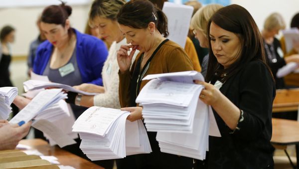 Ballot papers are sorted during the second day of the General Election count in Dundalk, Ireland February 28, 2016. Ballot papers are sorted during the second day of the General Election count in Dundalk, Ireland February 28, 2016. - Sputnik International